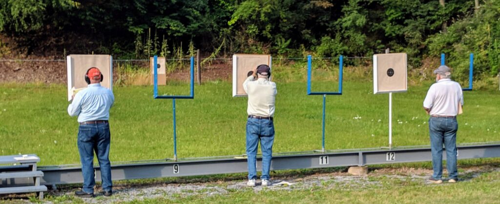 Checking targets for pistol bullseye