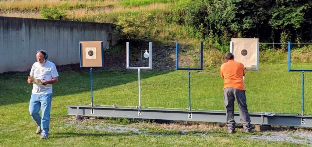 Checking targets for pistol bullseye